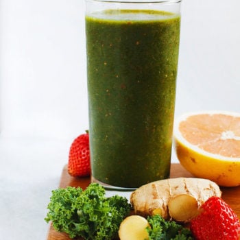 AMAZING green cleansing smoothie made with kale, fresh ginger, grape fruit, strawberries, and mangos. SO yum. | asimplepalate.com